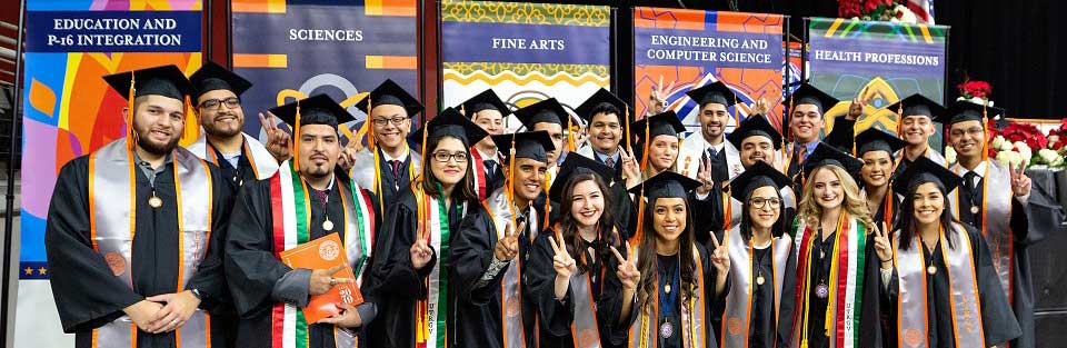Graduates from UT Rio Grande Valley in a group pose after the graduation ceremony