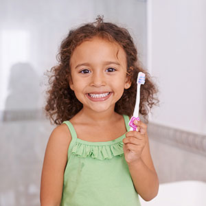 Girl brushing her teeth