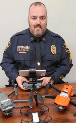Garry Douthitt with several drones.