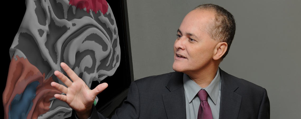 Jai Soares looking over an image of brain 