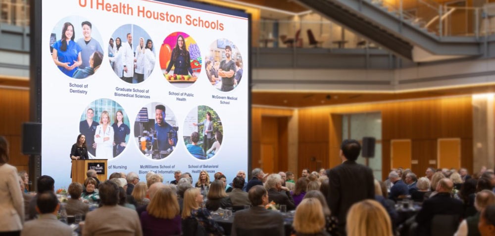 UTHealth Houston President Kibbe presenting slides