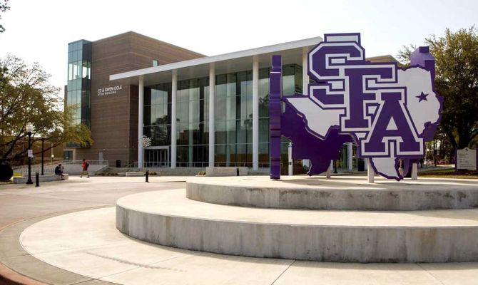 External photo of the commons area in Stephen F. Austin State University, with a large signage showing SFA on the state of Texas