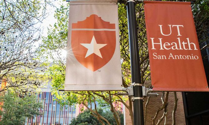 Exterior photo of a outdoor banners with UT Health Science Center Houston banners