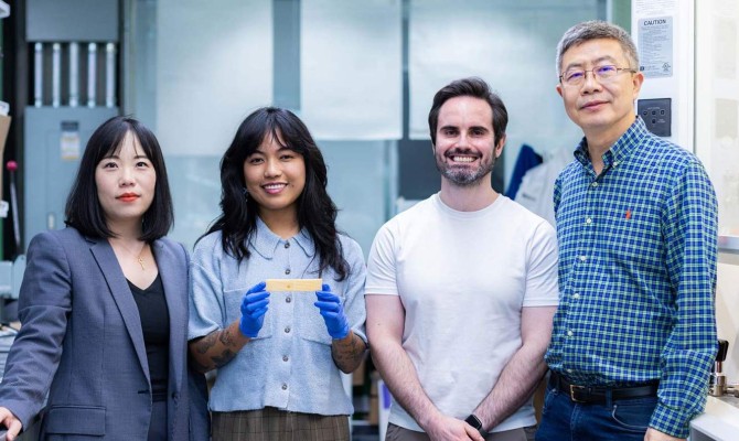 University of Texas at Dallas researchers led the development of a wood-based building material that can store and discharge heat. From left: Dr. Shuang (Cynthia) Cui, mechanical engineering doctoral students Bernadette Magalindan BS’21, MS’25 and Gustavo Felicio Perruci, and Dr. Hongbing Lu.