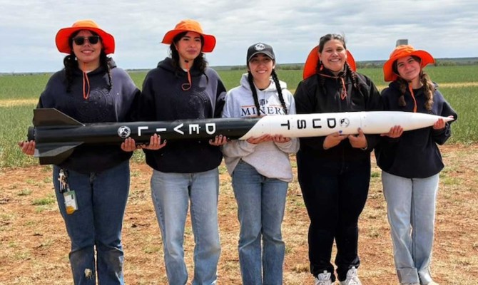UT El Paso's Rocket Team (L-R): Idhaly Torres, Rebecca Herrera, Hazel Perea, Viriany Cobos, and Priscila Garnica, all holding their rocket horizontally. 