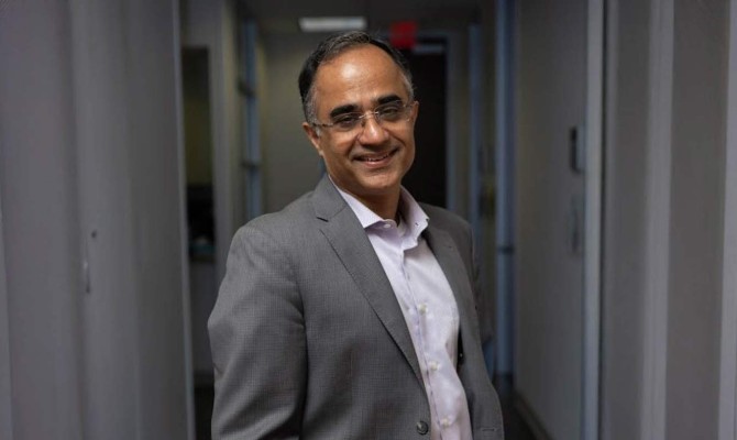Nitin Tandon, MD, in a hallway for a profile image