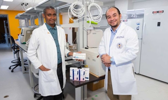 UTEP School of Pharmacy researchers Tadesse Abegaz, Ph.D., left, and Gabriel Frietze, Ph.D., right,