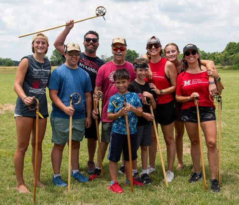 UT System assistant vice chancellor for academic Affairs Nichole Prescott, far right, poses with family members for a lacrosse match during a gathering of her Miami Tribe of Oklahoma.