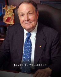 James T. Willerson profile photo at his desk, with the text of his name at the bottom of the image.
